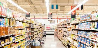 A grocery store aisle filled with various food products on shelves