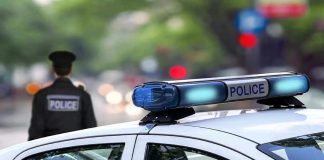 Cop ARRESTED – Badge Turns Predator! Police car and officer on a city street.