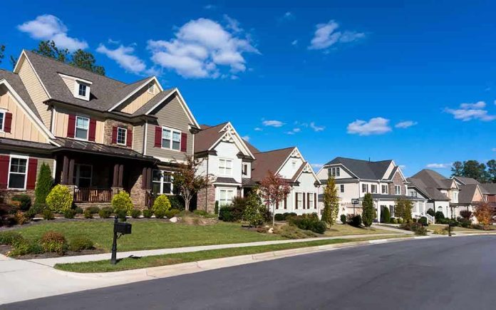 shutterstock_161232668 A row of modern suburban houses under a clear blue sky