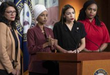 Four women politicians speaking at a press conference