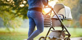 Homeless Psycho Launches Insane Stroller Attack! Person pushing a baby stroller on a park path