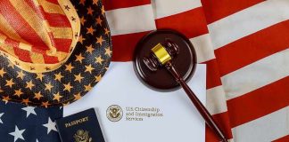 Trump Activates Unknown Law for the First Time Ever U.S. passport, gavel, and USCIS document on American flag