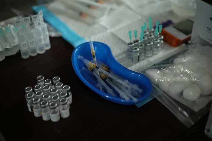 Medical syringes and vials arranged on a table