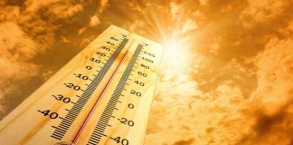 Hundreds HOSPITALIZED In Disaster Heatwave A thermometer displaying temperature against a sunset sky