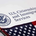 U.S. Citizenship and Immigration Services document with American flag