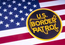 U.S. Border Patrol emblem on American flag