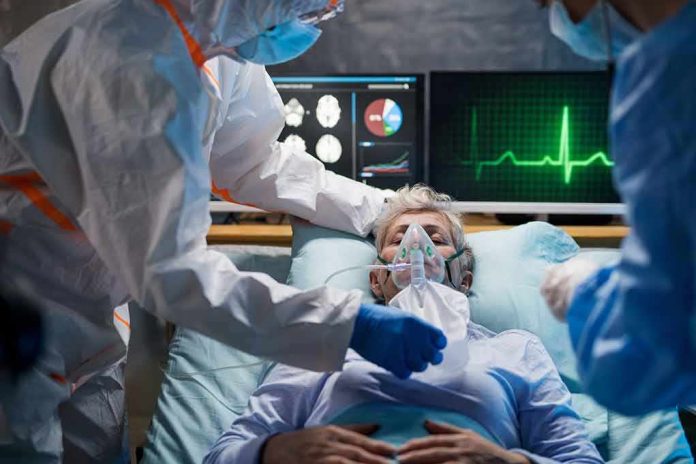 shutterstock_1661222104 Patient on hospital bed with oxygen mask