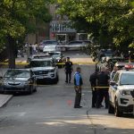 Police GUN DOWN College Star After Fatal Blunder Police officers secure a residential street with patrol cars and yellow tape