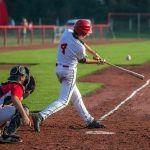 Baseball batter making contact with a pitched ball