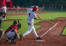 Baseball batter making contact with a pitched ball
