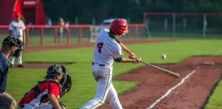 Baseball batter making contact with a pitched ball