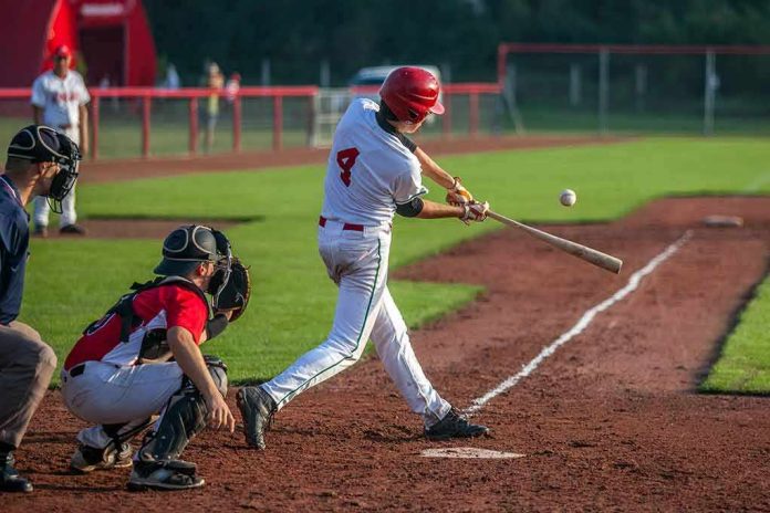 Baseball batter making contact with a pitched ball