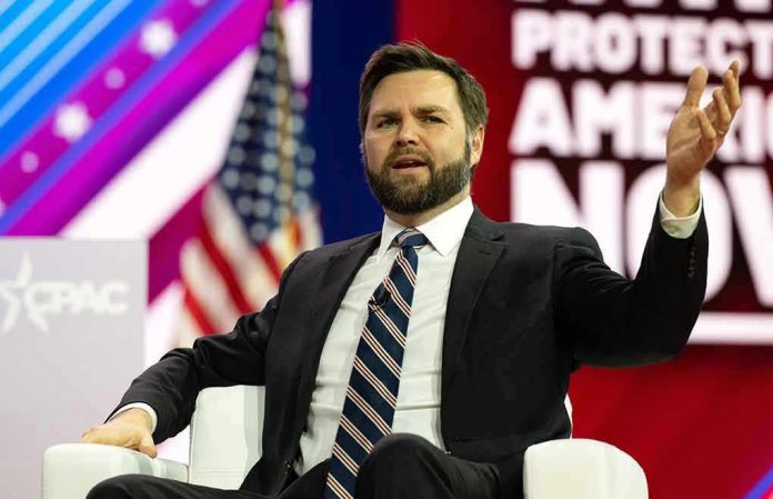 2270811647 Man in suit speaking on stage during a panel discussion