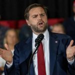 LEAKED Audio Shows Muslim Dem Hates the Second Amendment Man in suit speaking at a podium