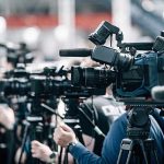 Congressman Bails As Plane Sinks Broadcast cameras on tripods at a press event
