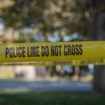 Stand-Your-Ground Shields Female Shooter yellow police tape cordoning off an outdoor area