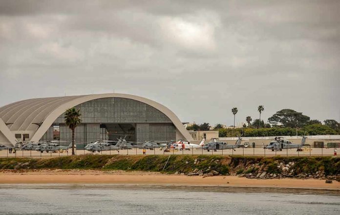 shutterstock_1086141389-1 airport hangar with helicopters near a shoreline
