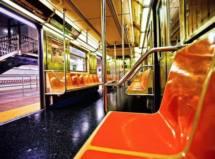 Empty subway car with orange seats and open doors