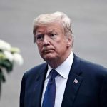 Trump Debuts Shock New ‘Look’ man in a suit with an American flag pin
