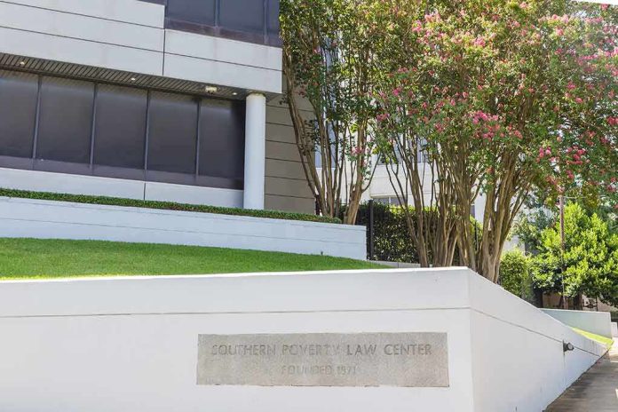 Modern office building with landscaped lawn and flowering trees