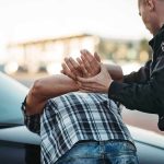 Secretary of State ARRESTED – Bodycam Footage LEAKED! Police officer detains person against car