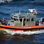 U.S. Coast Guard patrol boat speeding on open water