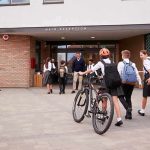 School Gunfire Chaos Caught on CCTV Camera Students in uniforms arriving at a school entrance