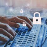 AI Hacks Government Database – LEAKS Millions Of Public Records Hands typing on laptop with digital padlock icons overlay