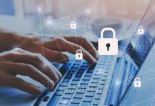 Hands typing on laptop with digital padlock icons overlay