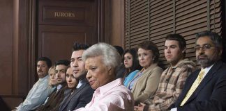 María Rojo and Jessica Bowman seated among jurors in a courtroom jury box