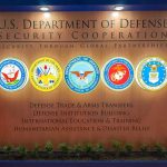Pentagon Axes 180 Faiths Overnight! U.S. Department of Defense display wall with service seals