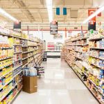 Socialist Grocery Store Has DISASTER Opening Day A grocery store aisle filled with various food products on shelves