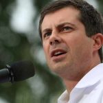 Buttigieg Demands Next President Be ‘Homosexual’ Pete Buttigieg speaking into a microphone outdoors