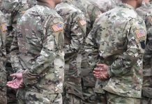 Soldiers in camouflage uniforms standing in formation
