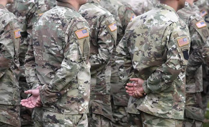 shutterstock_1548710321 Soldiers in camouflage uniforms standing in formation
