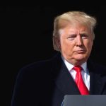 Trump BLASTS Reporter Inches From His Face Donald Trump at a podium with a microphone
