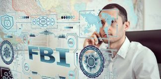 Man on phone behind digital interface with FBI and cybersecurity graphics