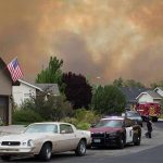 Hero Cop RESCUES Baby From Blazing Inferno! Emergency vehicles respond to wildfire near suburban homes
