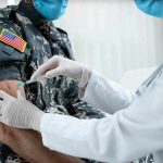 2,544 U.S Troops DEAD – Army Death Audit Launched Healthcare worker giving vaccine to person in military uniform