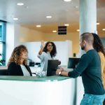 Migrant Psycho Kills 3 Americans Then Blames THIS Reception desk with staff assisting visitors