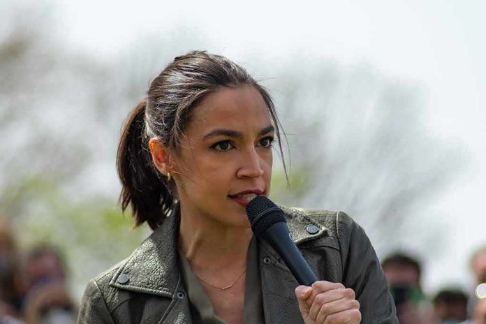 shutterstock_1962959698 AOC speaking into a handheld microphone outdoors