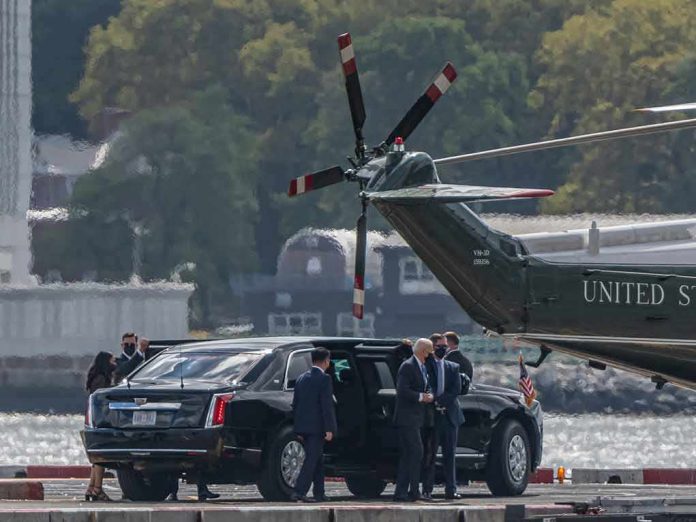 Motorcade and helicopter on a waterfront helipad
