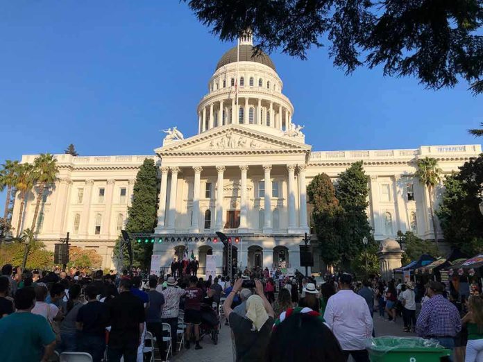 Crowd gathers before a neoclassical capitol building with dome