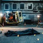 crime scene with body bag in alley