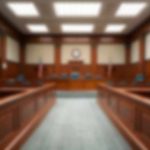 Teen Sentenced To LIFE After Horror Toddler Murder! Empty courtroom with wooden benches and judge's bench