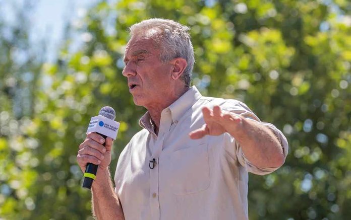 Man speaking into a microphone outdoors