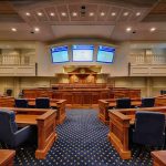 Courtroom interior with wooden benches and judge's bench