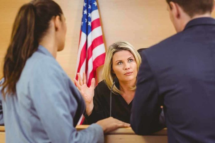 shutterstock_244310095 Judge speaking with two attorneys at the bench in a courtroom