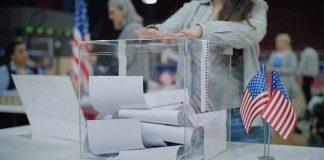 Red-State Stunned: Senate Race DEADLOCKED Person casting a ballot into a clear box at a polling station
