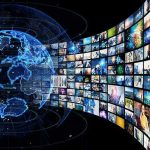 Hegseth Delivers Most WARPED Military Vision Yet Digital globe with curved wall of multimedia screens